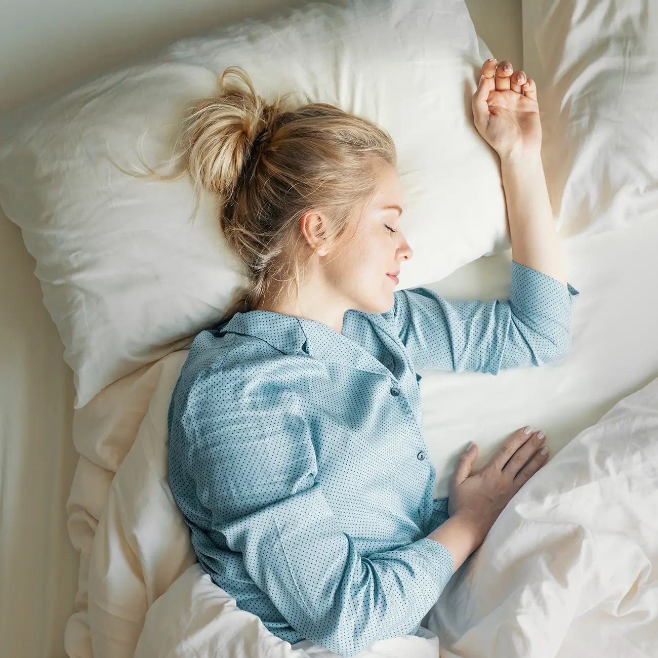 Woman fast asleep within her sleep cycle